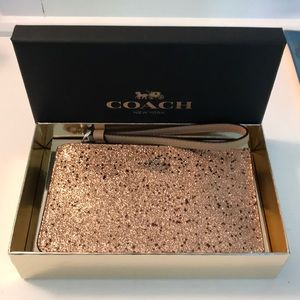 Rose gold coach wristlet